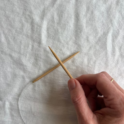 Circular knitting needles on white background, cord length 16, needle length 3.5.