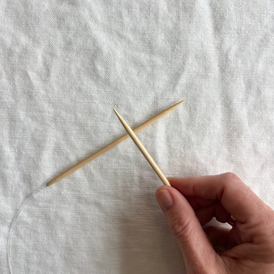 Circular knitting needles on white background, cord length 24", needle length 5".