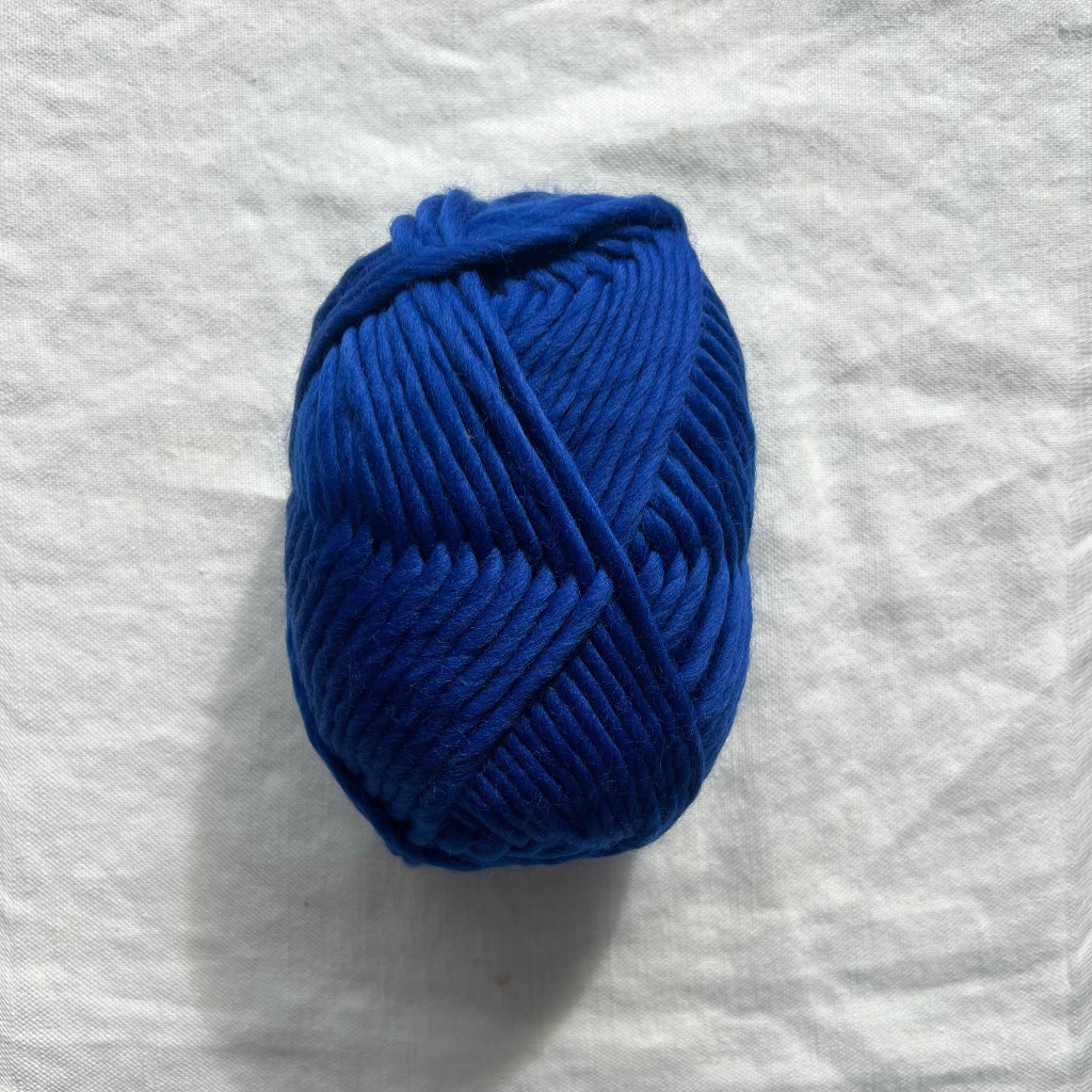 Blue yarn on white background