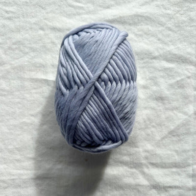 Blue yarn on white background