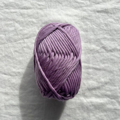 Purple yarn on white background