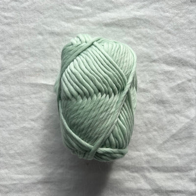 Green yarn on white background