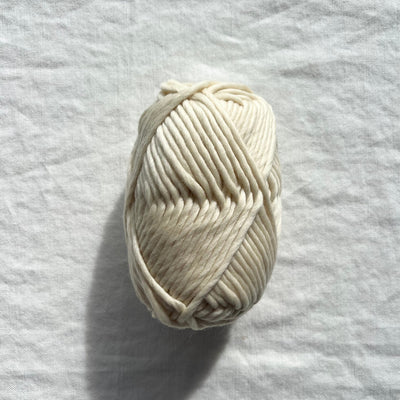 White yarn ball on white background