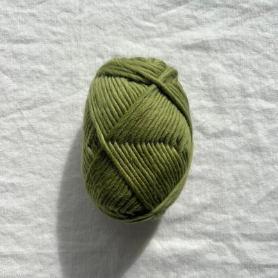 Green yarn on white background