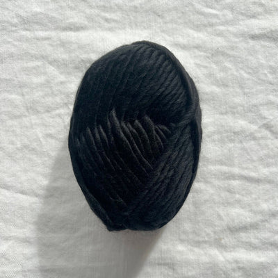 Black yarn on white background