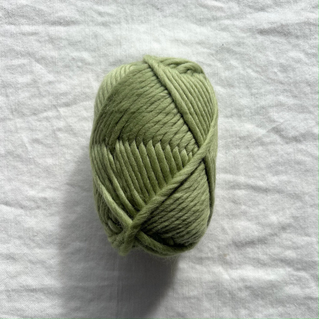 Green yarn on white background