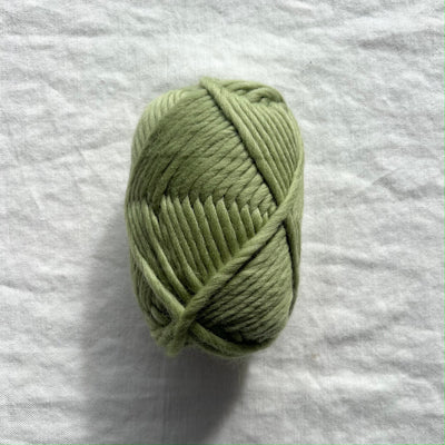 Green yarn on white background