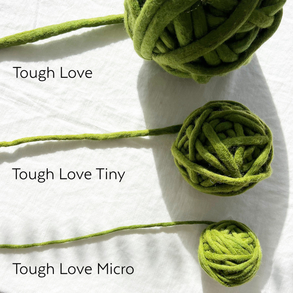 Three green yarn balls labeled 'Tough Love', 'Tough Love Tiny', and 'Tough Love Micro' on a white background.