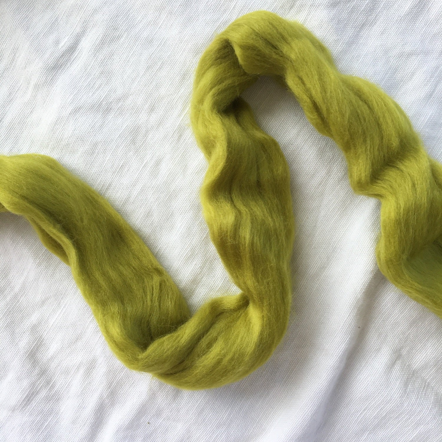 Meghan Shimek & Love Fest Fibers roving for weaving, knitting, crocheting, felting. Sustainable merino & Targhee fiber giant yarn.